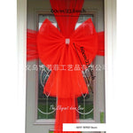 Décoration de porte avec nœud organza pour mariage