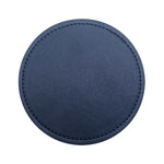 Tapis de souris rond en cuir bleu marine avec bordure en couture.