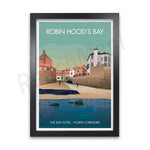 Un paysage pittoresque de la baie de Robin Hood, dans le Nord de l'Yorkshire, avec des maisons aux couleurs vives et un reflet des bâtiments dans l'eau calme.