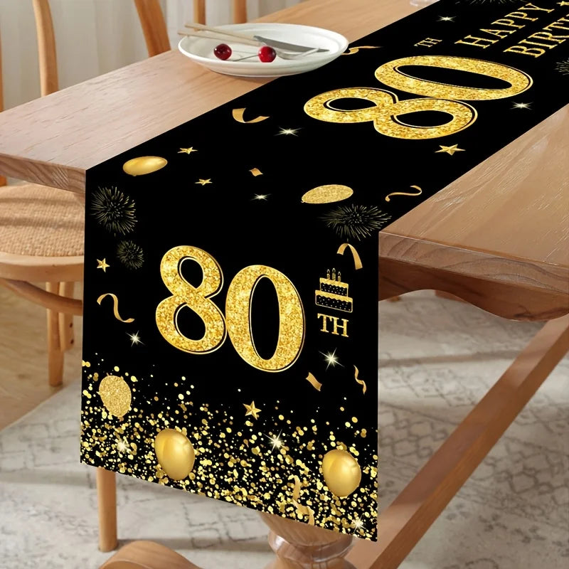 Drapeau de table noir et or pour 80e anniversaire sur une table décorée