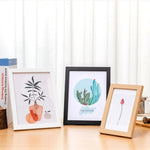 Cadre photo en bois 15x20 cm couleur blanc sur mur moderne