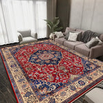 Tapis persan de style oriental avec un motif floral coloré et vibrant, posé sur un sol de pièce moderne avec des meubles gris.