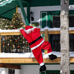 Père Noël en peluche escalade balcon décoration extérieure