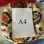 Vue de dessus du coussin rond de sol, montrant sa forme ronde et son remplissage confortable