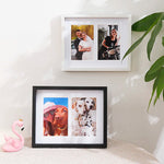 Cadre photo bois noir format vertical sur un mur blanc