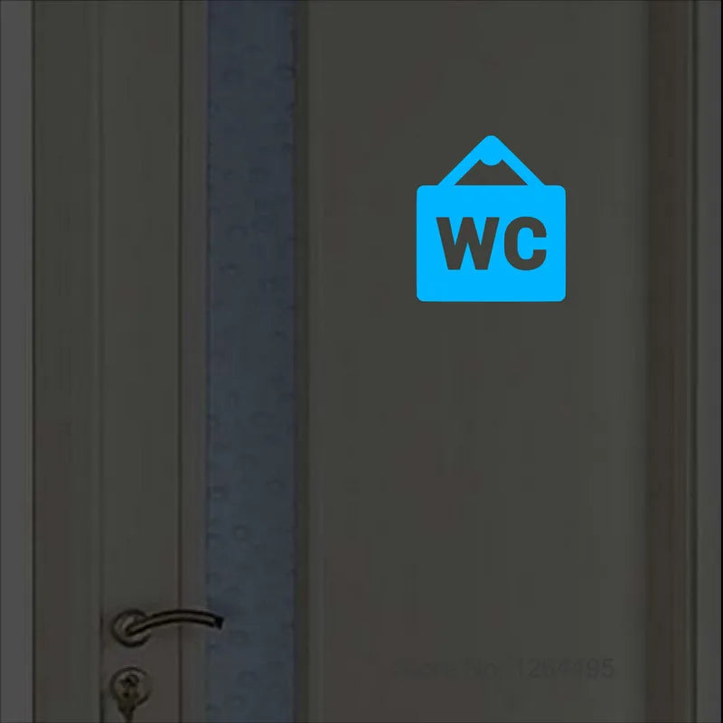Autocollant porte WC argenté brillant dans le noir