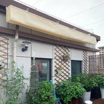Voile d'ombrage rétractable étanche grise installée sur pergola