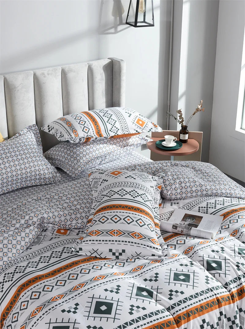Ensemble housse de couette et taies d'oreiller orange dépliées