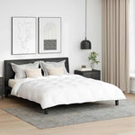 Parure de lit blanche 240x220 cm avec oreillers sur lit moderne