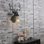 Applique murale LED installée dans une chambre à coucher