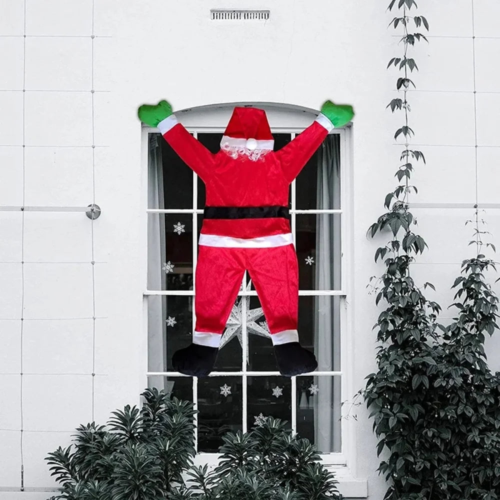 Décoration suspendue Père Noël sur toit maison