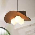 Lustre suspendu dans une chambre à coucher avec ambiance chaleureuse