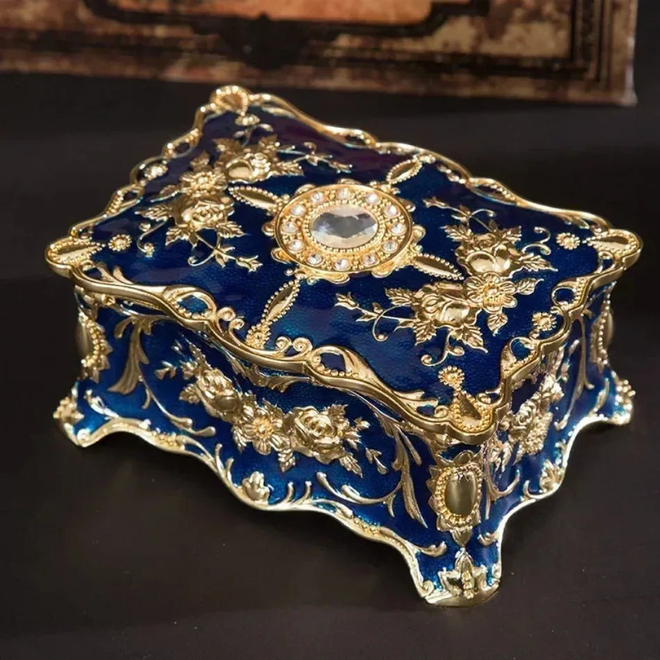 Coffret de rangement bleu avec bijoux organisés à l'intérieur