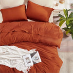 Taie d'oreiller avec pompons de la parure de lit terracotta