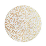 Motif décoratif circulaire avec des arabesques dorées sur fond blanc.