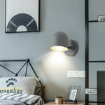 Détail de la tête rotative de l'applique murale macaron grise