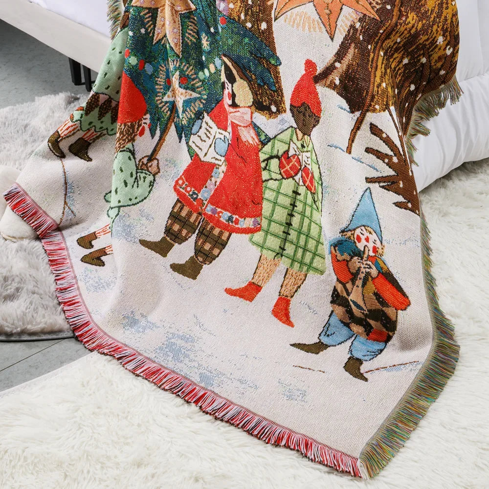 Magnifique couverture jacquard multicolore représentant des personnages dans un paysage hivernal festif.