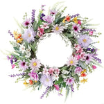 Couronne de fleurs artificielles saphir profond sur porte d'entrée blanche