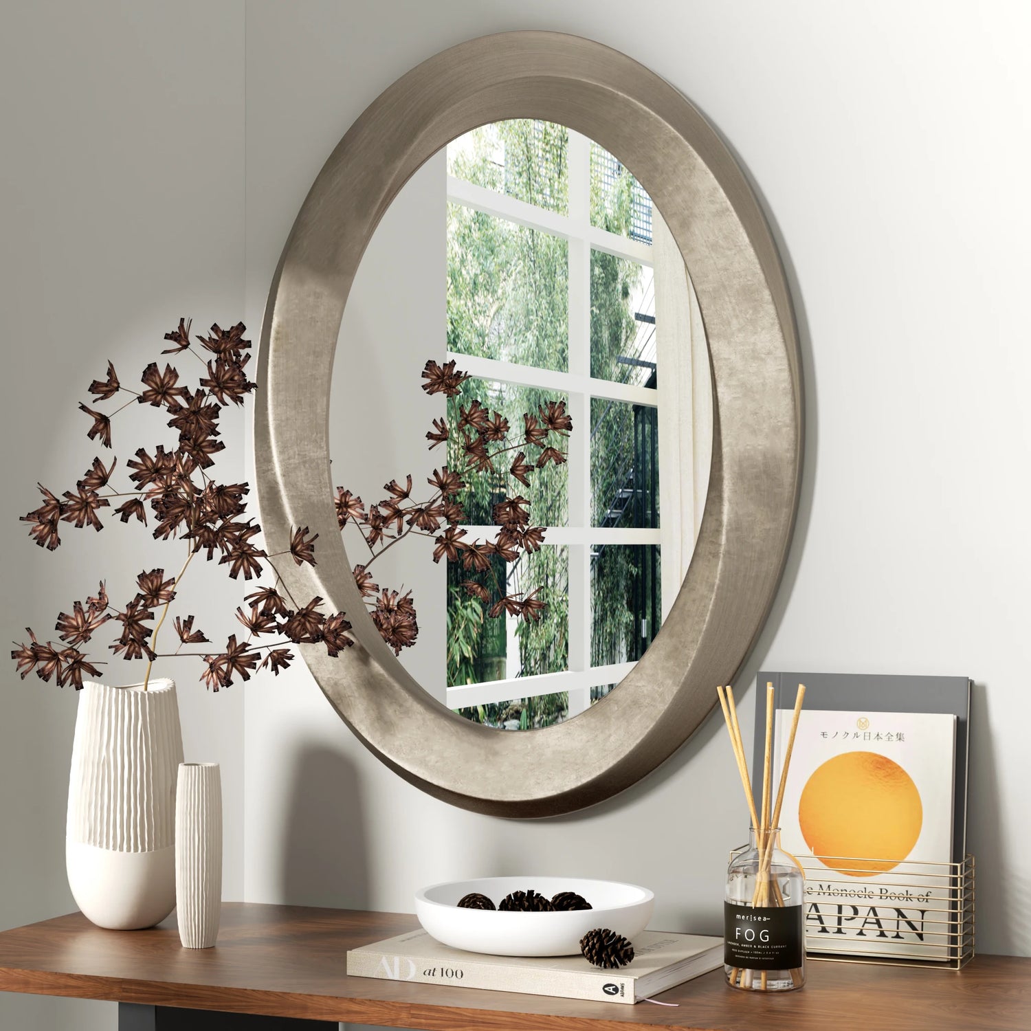 Miroir mural ovale baroque en verre argenté