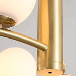 Lustre suspension blanc installé au-dessus d'une table à manger