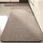 Table de cuisine au design minimaliste avec un revêtement de surface texturé de couleur grise.