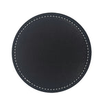 Disque en cuir noir avec une finition lisse et des surpiqûres blanches, convenant à une utilisation décorative ou fonctionnelle.
