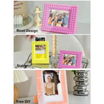 Cadre polaroid en couleur blanche exposant une photo Instax