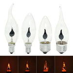Ampoule LED bougie allumée dans une lampe de chevet vintage