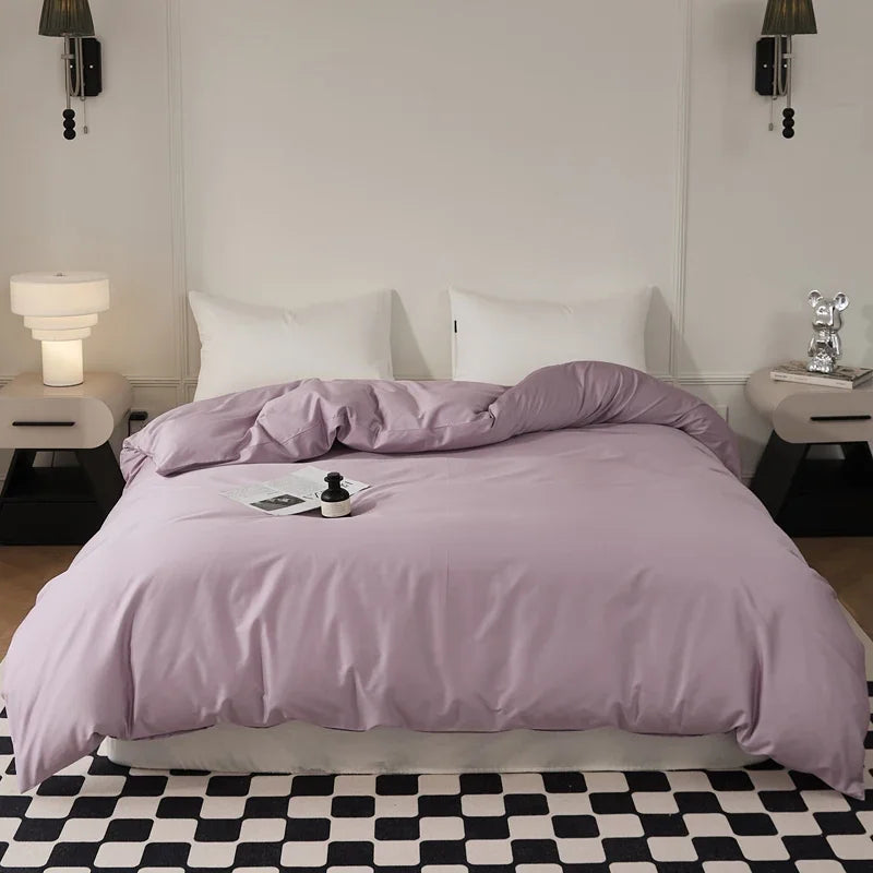 Housse de couette 90x200 en coton à longues fibres sur un lit