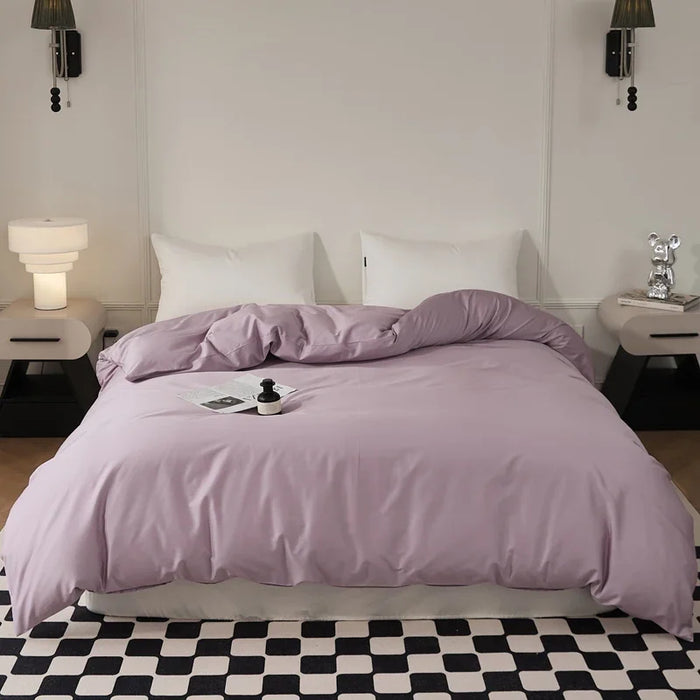 Housse de couette 90x200 en coton à longues fibres sur un lit