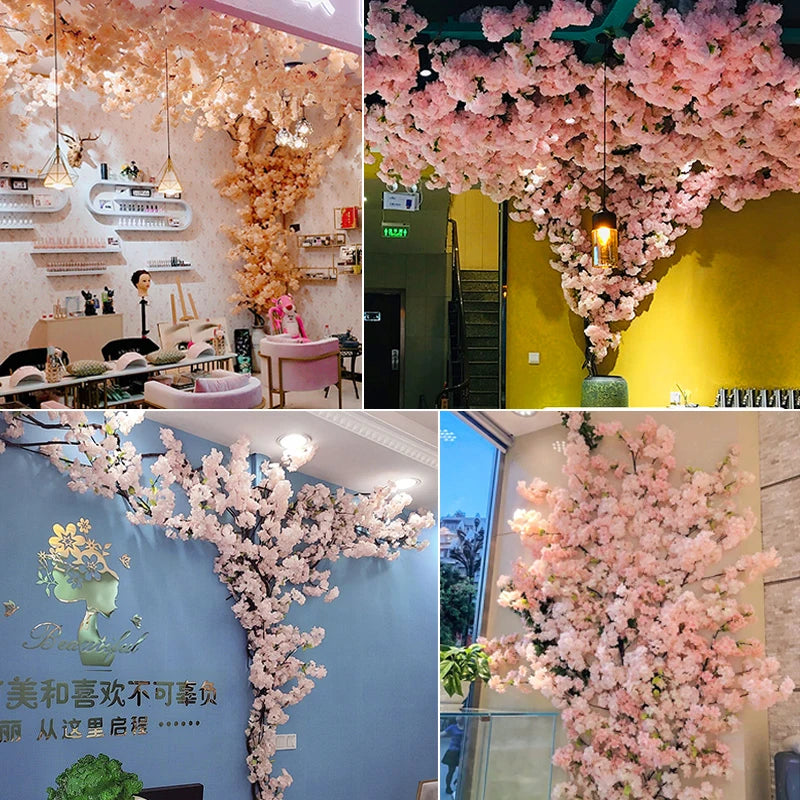 Guirlande de fleurs de cerisier artificielles roses sur mur blanc