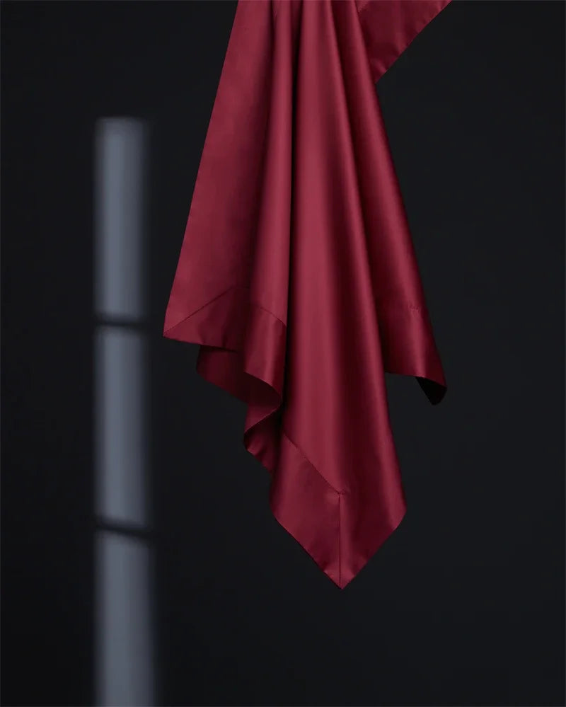 Drap plat bordeaux assorti à la housse de couette