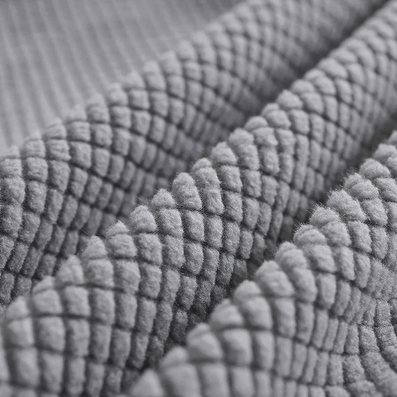 Détail de la housse de tête de lit bleu marine avec texture polaire