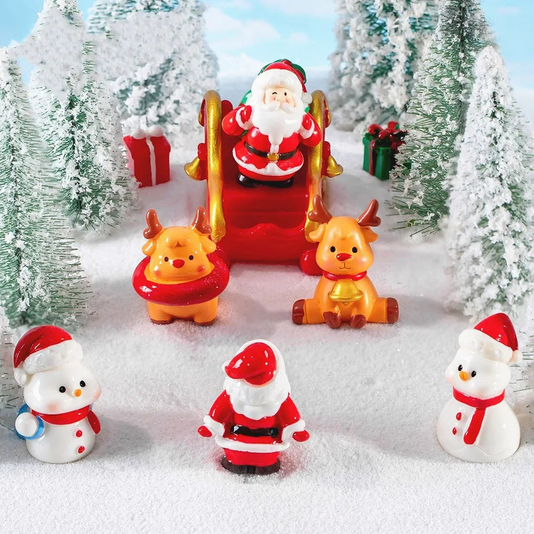 Figurine de Père Noël en résine couleur vert clair sur table festive