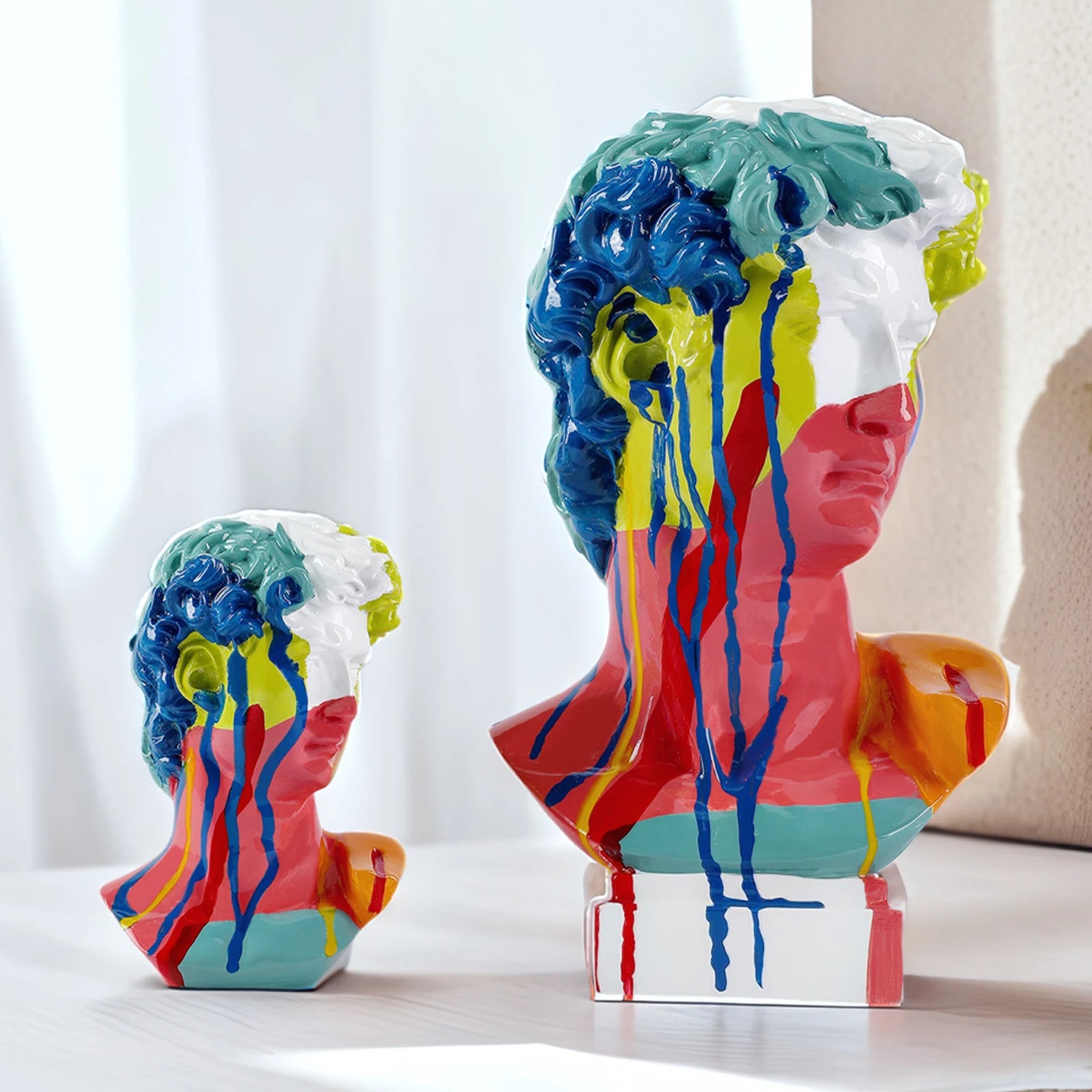 Comparaison des deux tailles de sculpture tête de David en résine