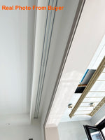 Installation au plafond du rail de rideau double