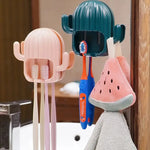Porte-brosse à dents mural rose avec brosses à dents rangées