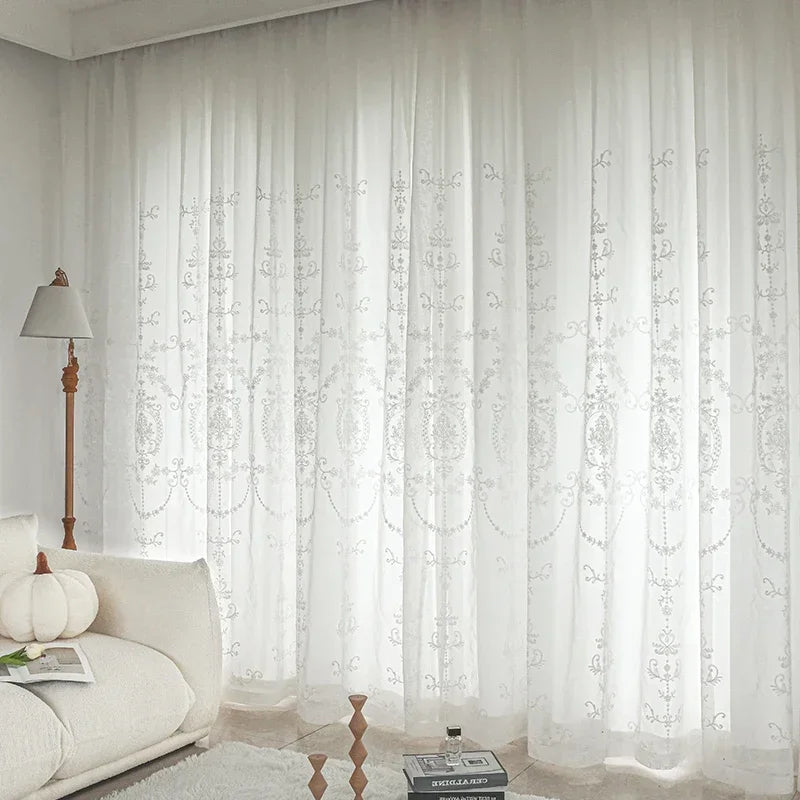 Magnificent white embroidered tulle curtains for an elegant and bright interior