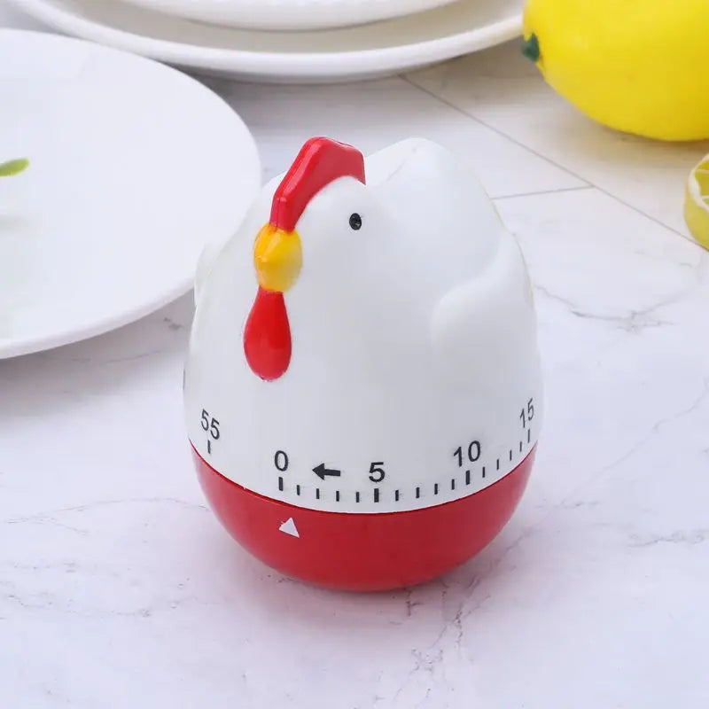 Comparaison taille de la minuterie poule avec main pour échelle