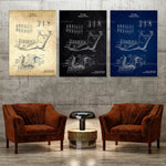 Des affiches d'anatomie dentaire ornent les murs, encadrées dans des couleurs neutres, tandis que deux fauteuils en cuir marron invitent à la détente dans ce cadre élégant.