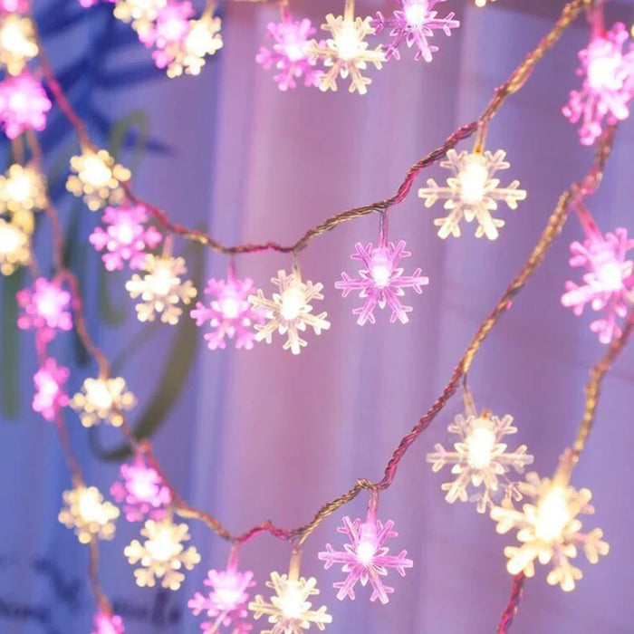 Guirlande lumineuse à piles 3m avec LED flocons étoiles roses allumée