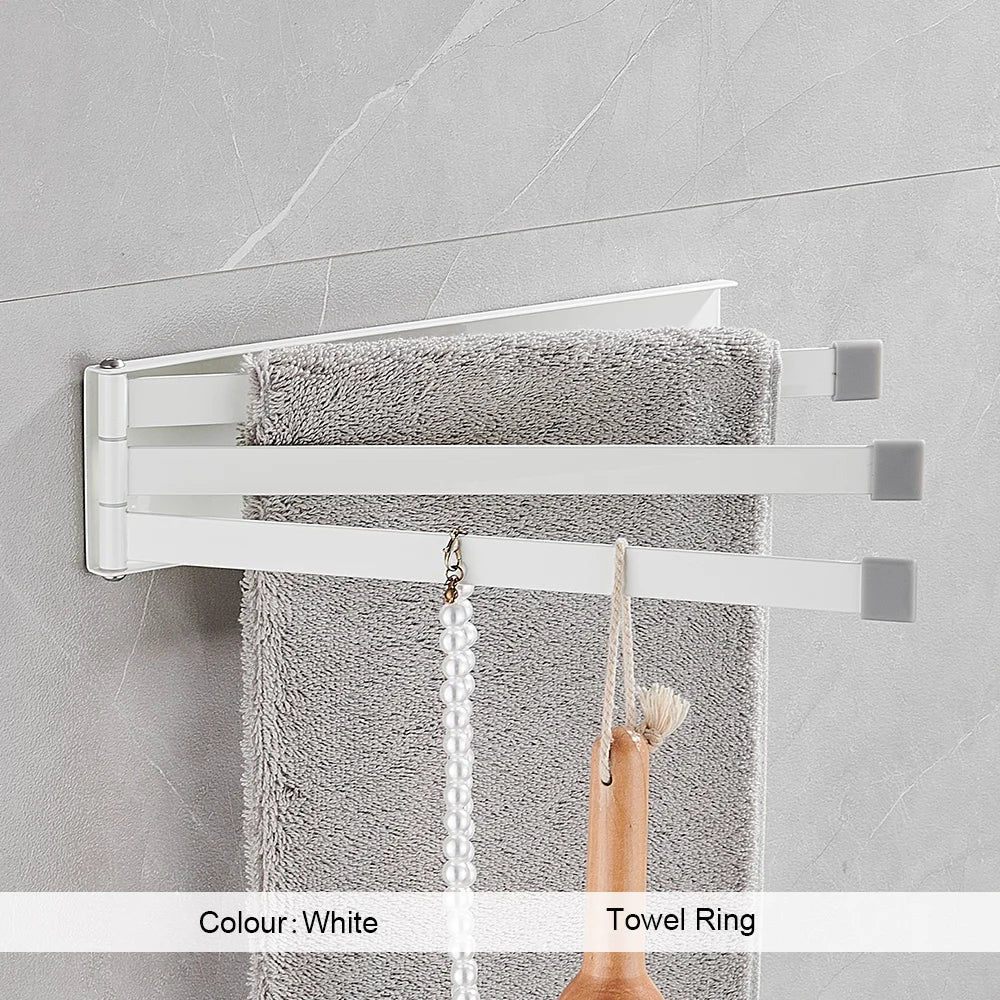 Porte-serviettes double barre installé dans une salle de bain moderne avec serviettes suspendues