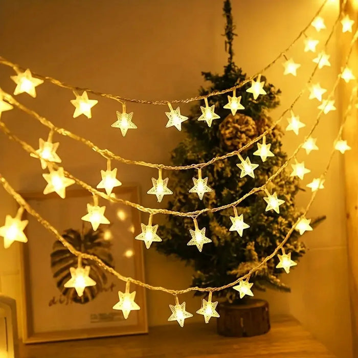 Guirlande lumineuse étoile LED blanche chaude suspendue dans une chambre