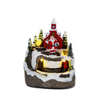 Maison de Noël en résine vue de face avec décorations