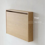 Bureau replié contre le mur