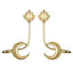 Boucles d'oreilles dorées ornées de motifs floraux et de formes géométriques.