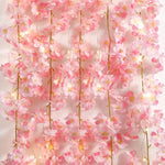 Guirlande lumineuse fleurs cerisier sur tête de lit