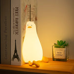 Veilleuse canard en position couchée avec lumière bleue apaisante