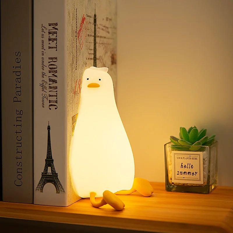Veilleuse canard en position couchée avec lumière bleue apaisante
