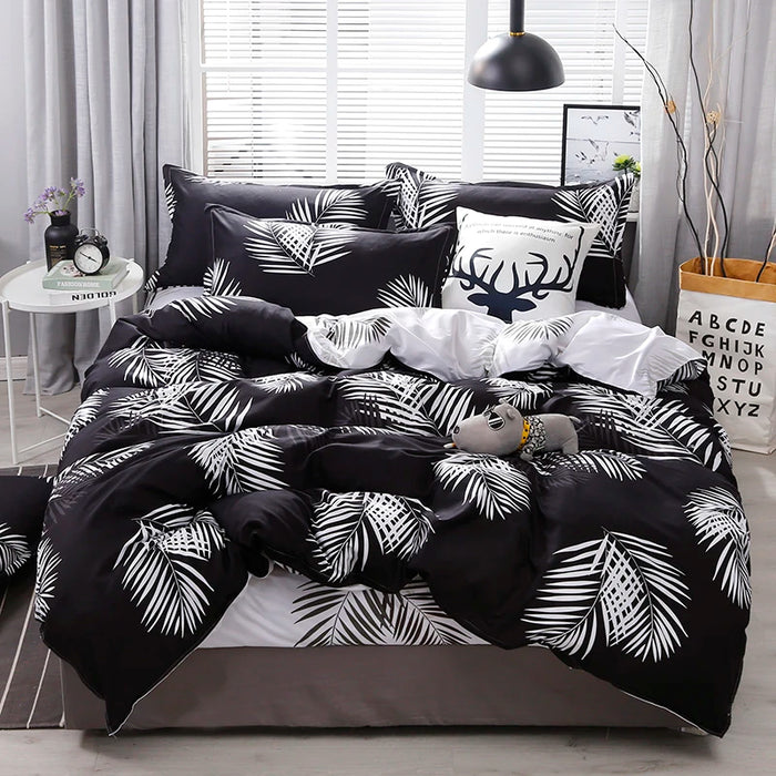 Housse de couette feuille de palmier réversible noir et blanc sur lit